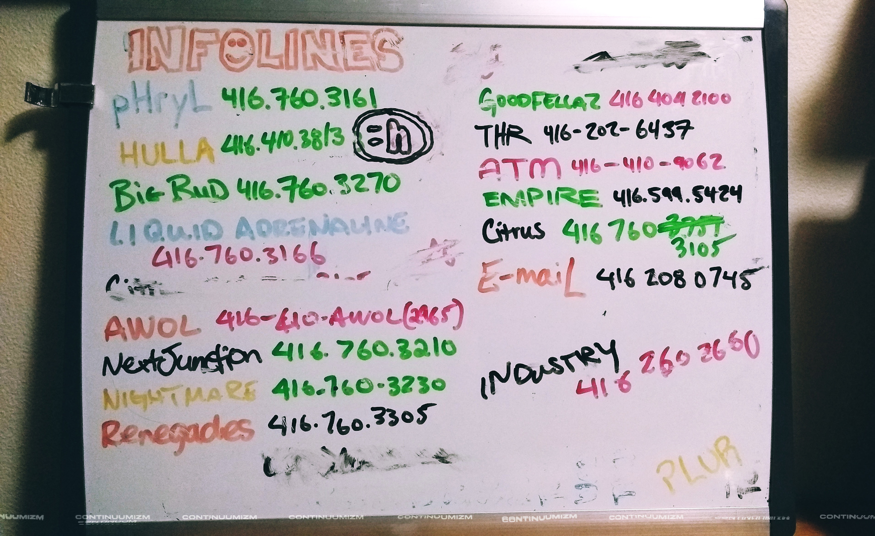 Rave infoline numbers seen on a whiteboard in multiple colours for party promoters in the late 90s in Toronto. Hotlines with 416 area code that wasn't mandatory in earlier party years including pHryL, Hullabaloo, Big Bug, Liquid Adrenaline, AWOL, Next Junction, Nightmare, Renegades, Goodfellaz, THR, ATM, Empire, Citrus, E-maiL, and the club Industry. PLUR included for good measure.